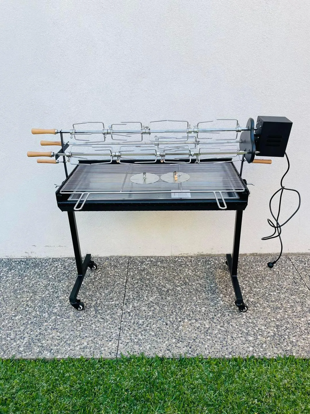 Spit hire rig side view showing electric motor and rotisserie assembly