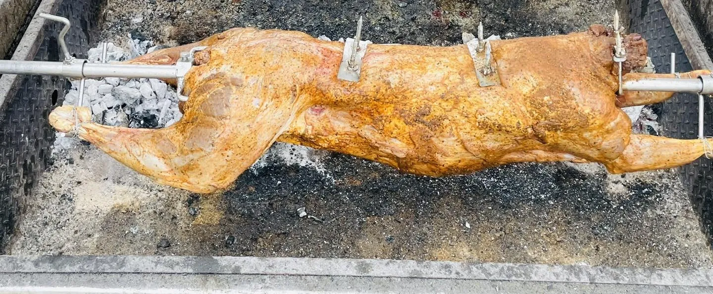 Ivan Tomic cooking venison on the charcoal spit